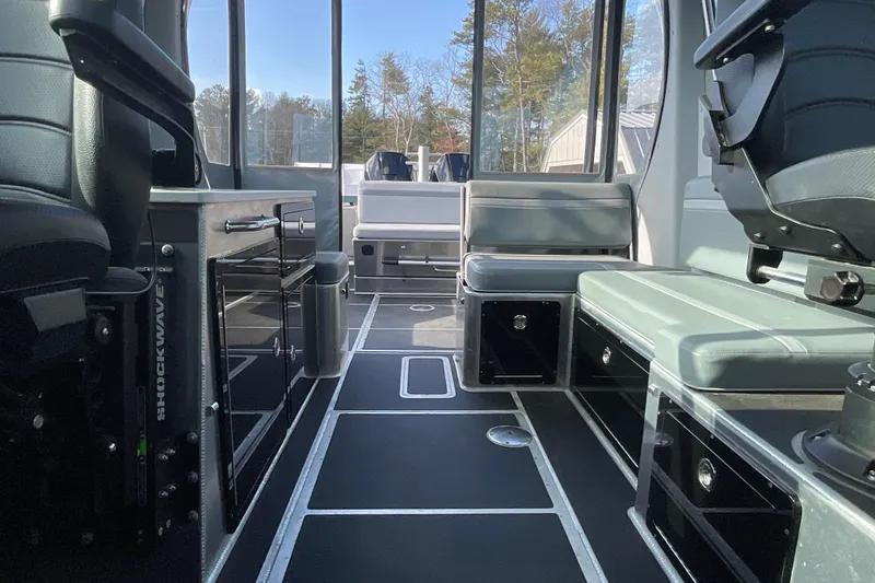 Slide: The Image of Interior of 2025 Life Proof 31 GT Coupe boat with modern seating and storage. - 14