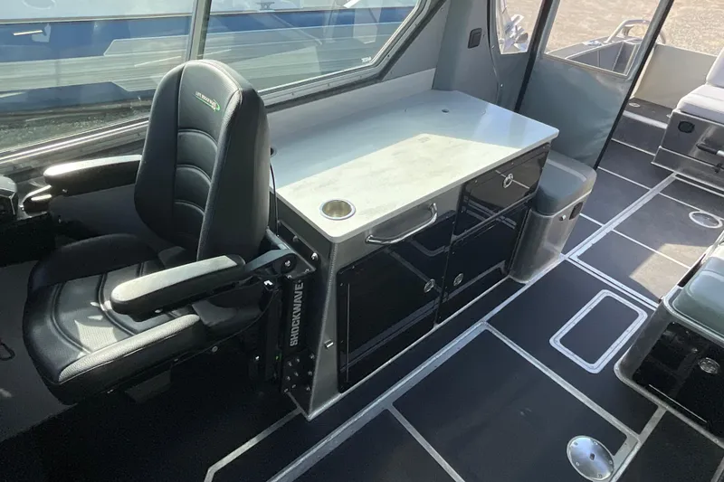 Slide: The Image of Interior of 2025 Life Proof 31 GT Coupe with sleek seating and modern cabinetry. - 16