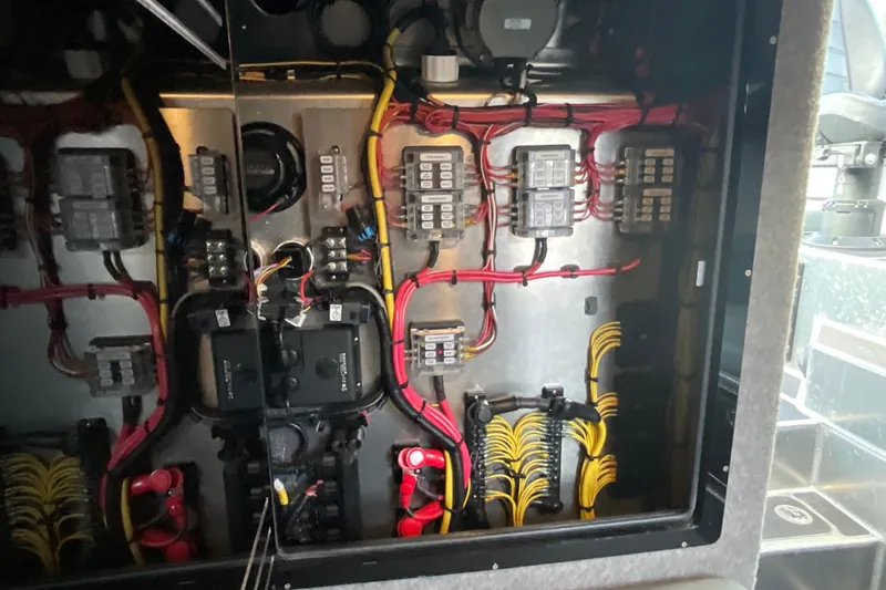Slide: The Image of Electrical panel of 2025 Life Proof 31 GT Coupe with organized wiring and components. - 23