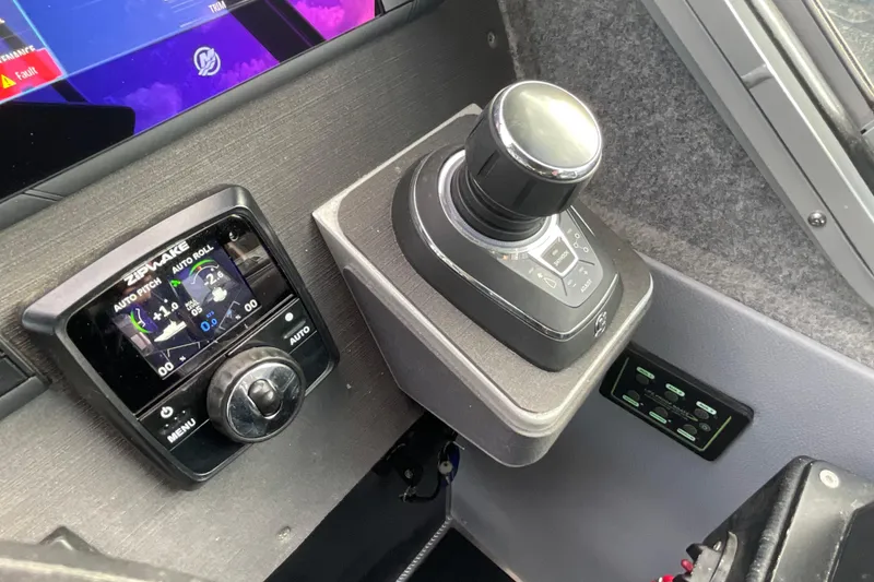 Slide: The Image of Control panel of 2025 Life Proof 31 GT Coupe with joystick and Zipwake display. - 25