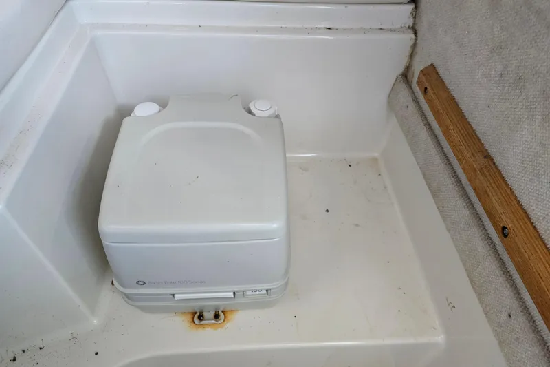 Slide: The Image of Portable toilet in 2004 Seaswirl Striper 2101 Walkaround O/B boat cabin. - 9