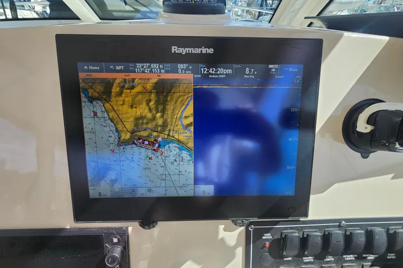 Slide: The Image of Raymarine navigation display on 2018 Boston Whaler 315 Conquest boat dashboard. - 14