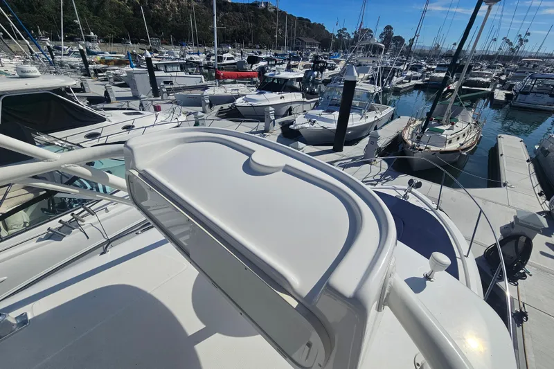 Slide: The Image of 2018 Boston Whaler 315 Conquest docked in a busy marina. - 21