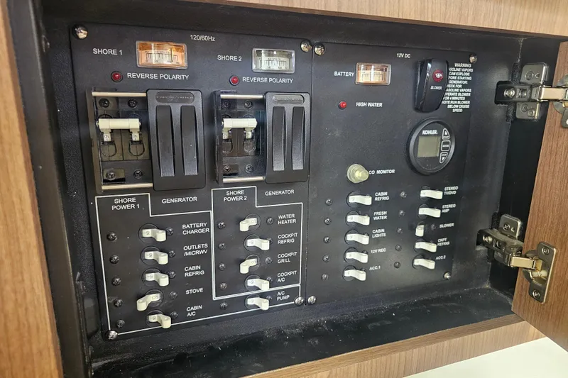 Slide: The Image of Electrical control panel of a 2018 Boston Whaler 315 Conquest boat. - 37