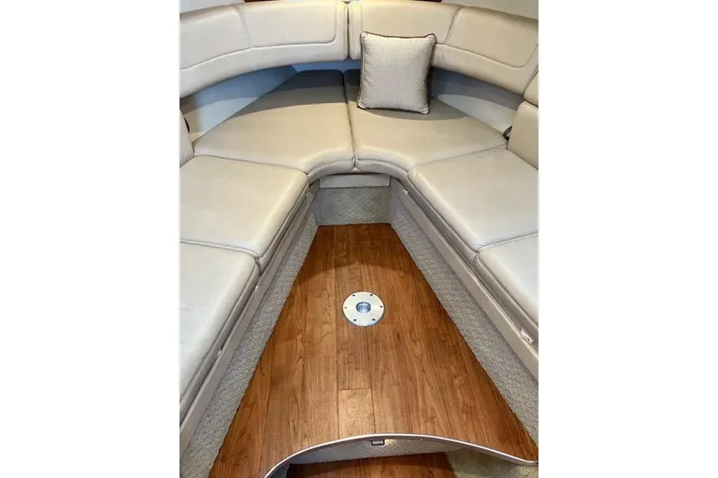Slide: The Image of Interior of 2009 Formula 350 Sun Sport boat with beige seating and wooden flooring. - 11