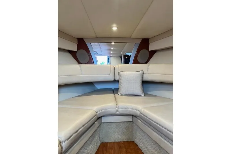 Slide: The Image of Interior of 2009 Formula 350 Sun Sport boat with beige seating and cushion. - 12