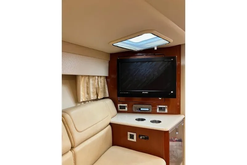 Slide: The Image of Interior of 2009 Formula 350 Sun Sport with TV and beige seating. - 15
