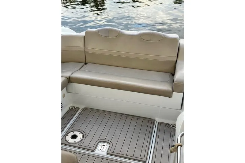 Slide: The Image of 2009 Formula 350 Sun Sport boat interior with beige seating and teak-style flooring. - 20
