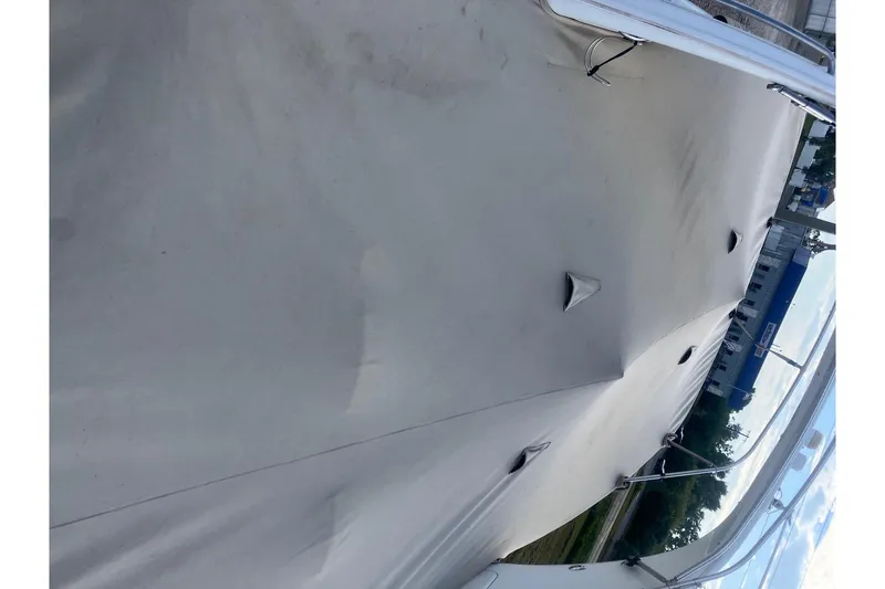 Slide: The Image of 2009 Formula 350 Sun Sport boat covered with protective tarp. - 4