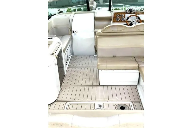 Slide: The Image of 2009 Formula 350 Sun Sport boat interior with beige seating and sleek dashboard. - 6