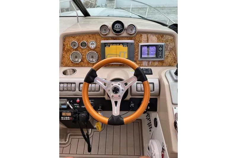 Slide: The Image of 2009 Formula 350 Sun Sport dashboard with wood accents and modern navigation instruments. - 7
