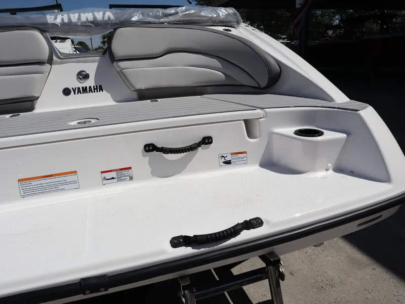 Slide: The Image of Yamaha Boats SX190 2026, rear view with seating area and cup holder. - 24