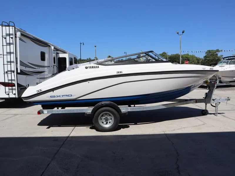 Slide: The Image of 2026 Yamaha SX190 boat on trailer in sunny weather. - 5