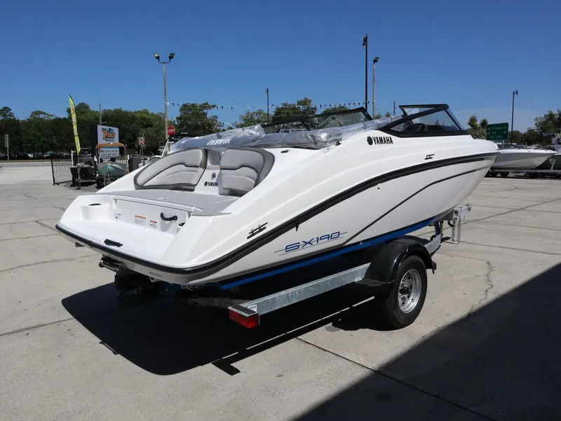 Slide: The Image of 2026 Yamaha SX190 boat on trailer outdoors. - 6