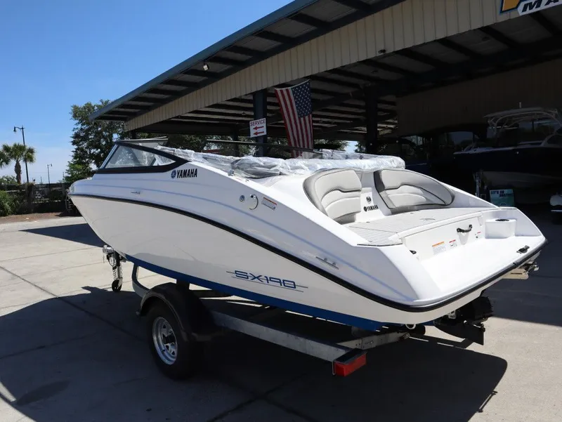 Slide: The Image of Yamaha Boats SX190 2026 on trailer, white design, displayed outdoors. - 8