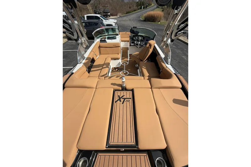 Slide: The Image of 2019 MasterCraft XT20 boat interior with tan seating and sleek design. - 3