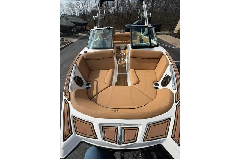 Slide: The Image of 2019 MasterCraft XT20 boat with tan seating and sleek design. - 4