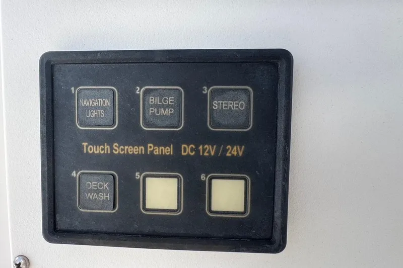 Slide: The Image of Touch screen panel on 1998 Legacy Boat 220 Sea Era, featuring navigation lights and bilge pump controls. - 10