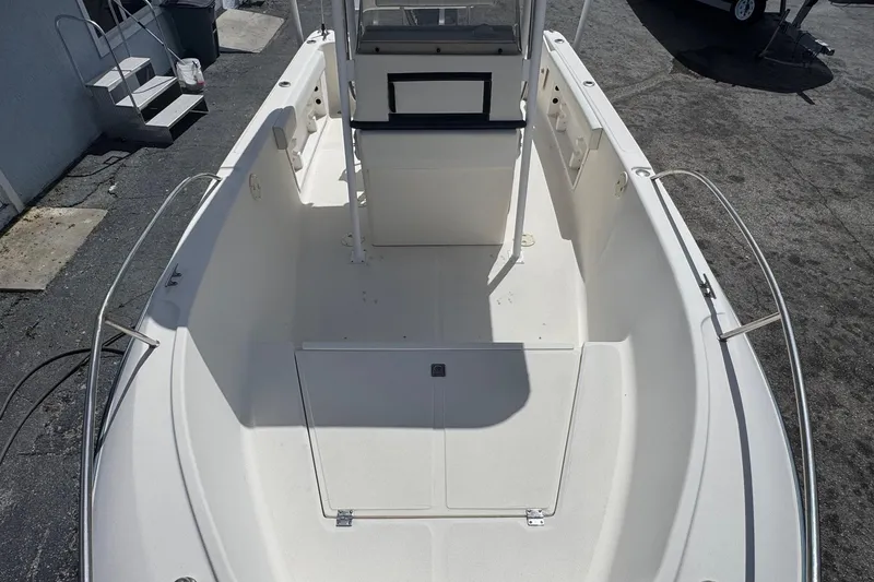Slide: The Image of 1998 Legacy Boat 220 Sea Era, spacious deck view, clean and well-maintained. - 15