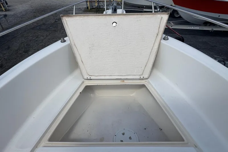 Slide: The Image of Open storage compartment on 1998 Legacy Boat 220 Sea Era deck. - 18