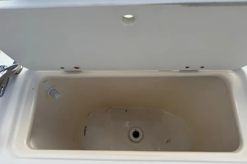 Slide: The Image of Open storage compartment on 1998 Legacy Boat 220 Sea Era, showing interior details. - 20