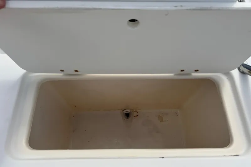 Slide: The Image of Open storage compartment on 1998 Legacy Boat 220 Sea Era. - 21
