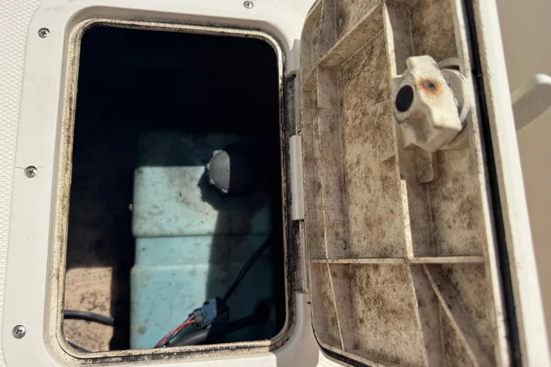 Slide: The Image of Open storage compartment on 1998 Legacy Boat 220 Sea Era, showing interior details. - 24