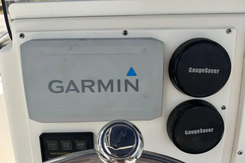Slide: The Image of Garmin navigation system on 1998 Legacy Boat 220 Sea Era dashboard. - 6