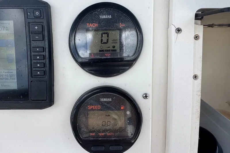 Slide: The Image of Yamaha tachometer and speedometer on 1998 Legacy Boat 220 Sea Era dashboard. - 9