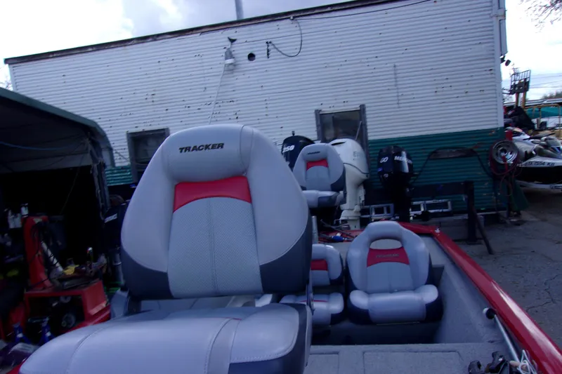 Slide: The Image of 2012 Tracker Pro Team 175 TXW boat seats with motors in background. - 12