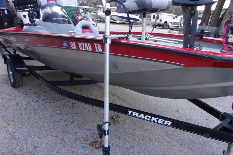 Slide: The Image of 2012 Tracker Pro Team 175 TXW boat on trailer, parked outdoors. - 13