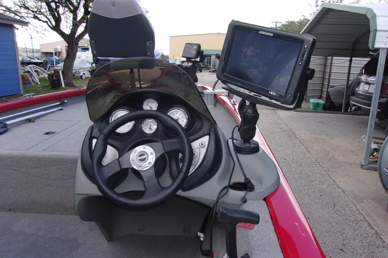 Slide: The Image of 2012 Tracker Pro Team 175 TXW boat dashboard with steering wheel and fish finder. - 5