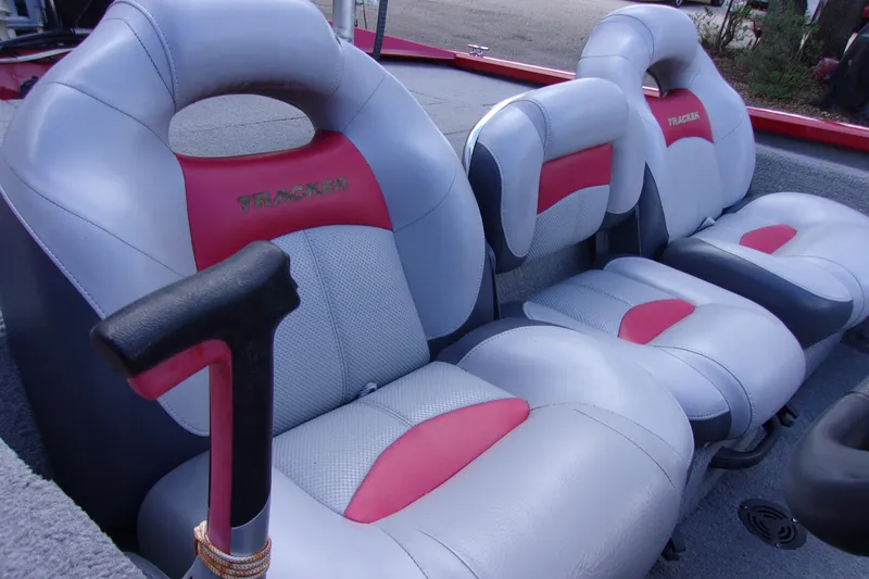 Slide: The Image of 2012 Tracker Pro Team 175 TXW boat seats, gray and red upholstery, close-up view. - 6