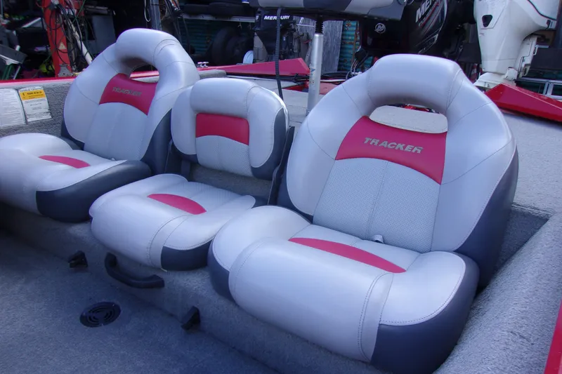 Slide: The Image of 2012 Tracker Pro Team 175 TXW boat seats with red and gray upholstery. - 7