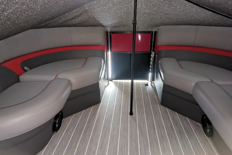 Slide: The Image of Interior of 2023 Trifecta 20CC 2.75 pontoon boat with gray and red seating. - 15
