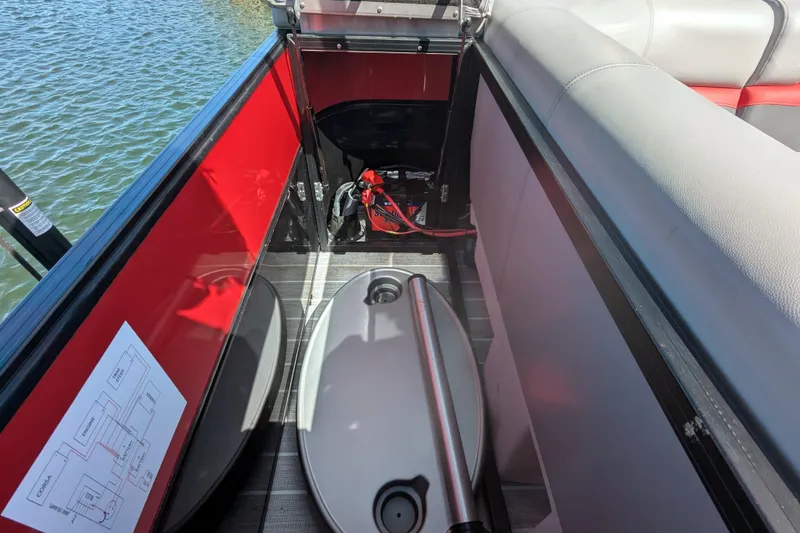 Slide: The Image of Interior view of 2023 Trifecta 20CC 2.75 boat, featuring seating and storage area. - 9