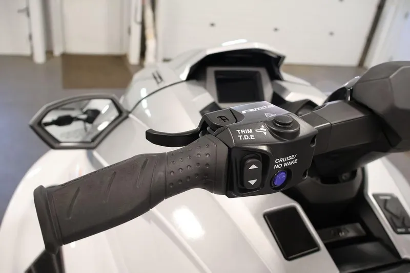 Slide: The Image of Close-up of 2026 Yamaha WaveRunner GP HO handlebar controls in a showroom. - 15