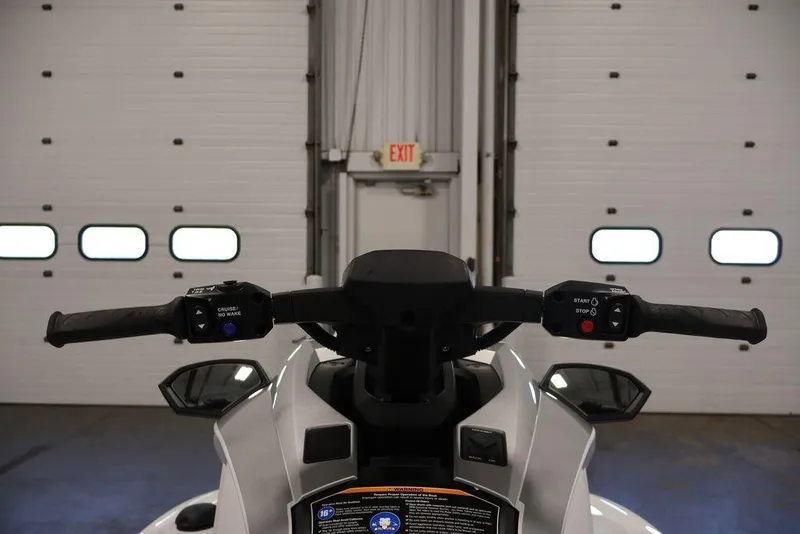 Slide: The Image of 2026 Yamaha WaveRunner GP HO handlebars in a garage setting. - 4