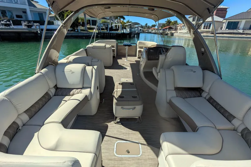 Slide: The Image of Luxurious 2022 Bennington QXFBAX2 pontoon boat with spacious seating and elegant design. - 14