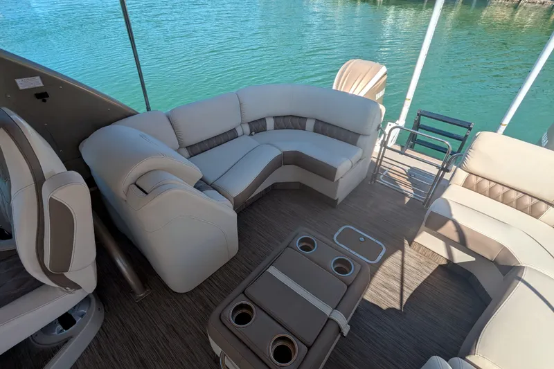 Slide: The Image of Luxurious seating on 2022 Bennington QXFBAX2 pontoon boat with lake view. - 16