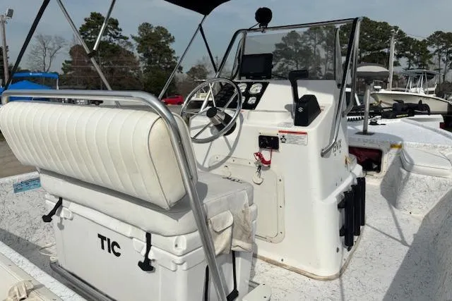 Slide: The Image of 2009 Kenner 19VX boat interior with steering console and seating. - 13