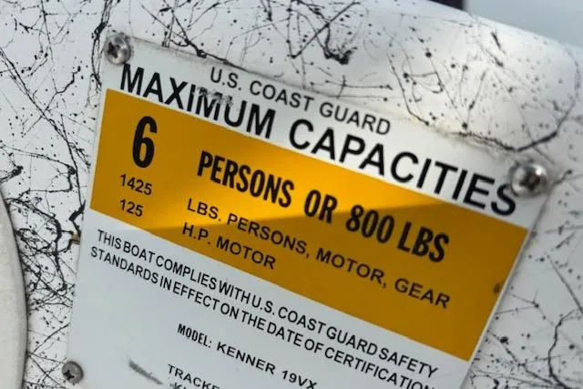 Slide: The Image of U.S. Coast Guard capacity label on 2009 Kenner 19VX boat, maximum 6 persons or 800 lbs. - 16