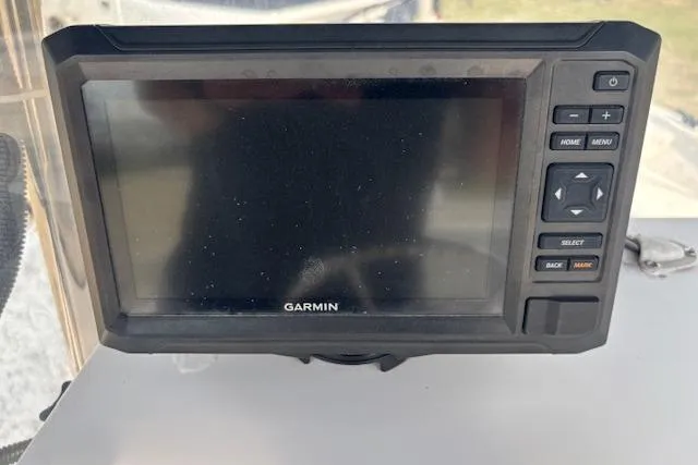 Slide: The Image of Garmin marine GPS device on 2009 Kenner 19VX boat dashboard. - 29