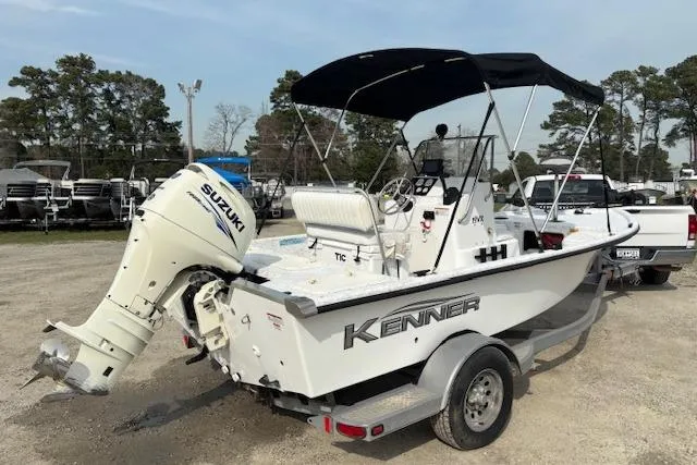 Slide: The Image of 2009 Kenner 19VX boat with Suzuki outboard motor on trailer. - 3