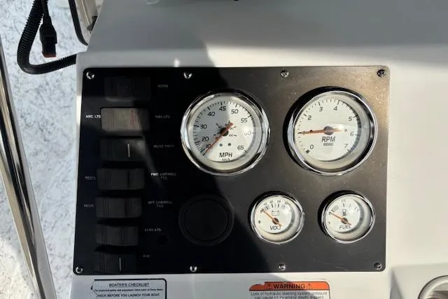 Slide: The Image of Dashboard of a 2009 Kenner 19VX boat with speedometer and RPM gauges. - 30