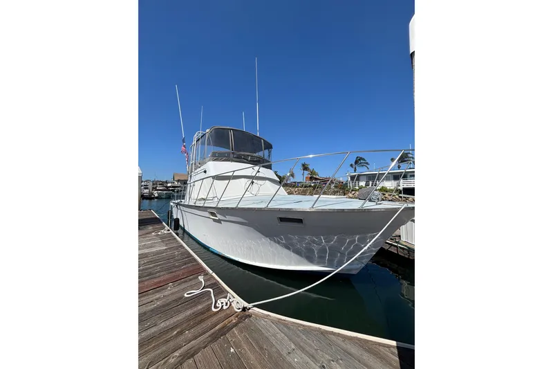The Image of 1973 Luhrs 290 Sport Fisherman docked, showcasing sleek design and sturdy build. - 1