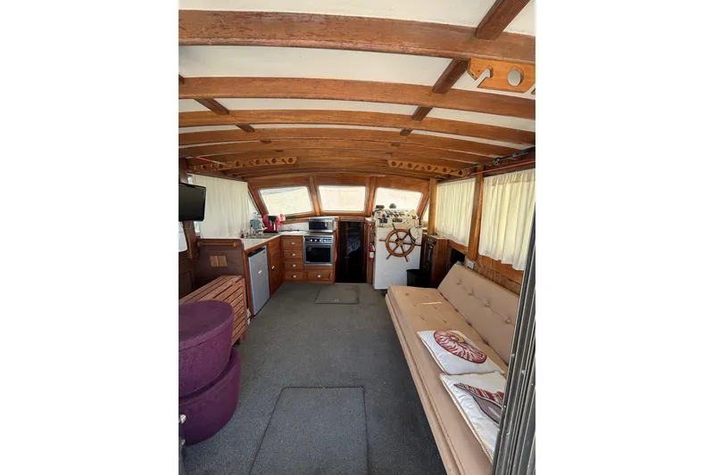 Slide: The Image of Interior of 1973 Luhrs 290 Sport Fisherman with wooden accents and cozy seating. - 4