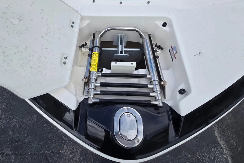 Slide: The Image of 2019 Chaparral 230 Suncoast boat ladder and hatch detail. - 10