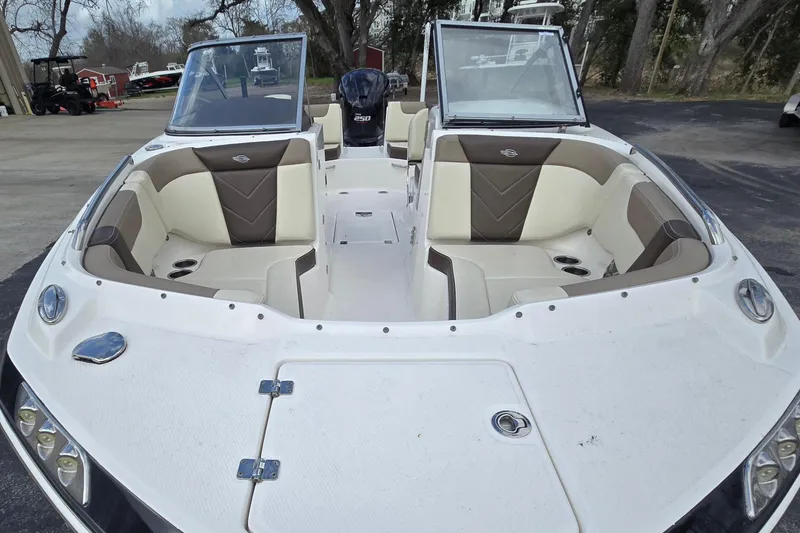 Slide: The Image of 2019 Chaparral 230 Suncoast boat with spacious seating and sleek design. - 11
