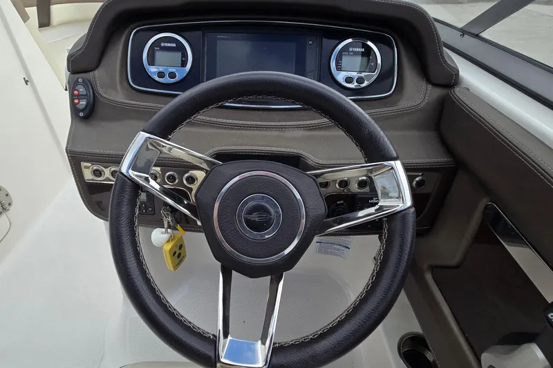 Slide: The Image of Steering wheel and dashboard of 2019 Chaparral 230 Suncoast boat with Yamaha controls. - 20